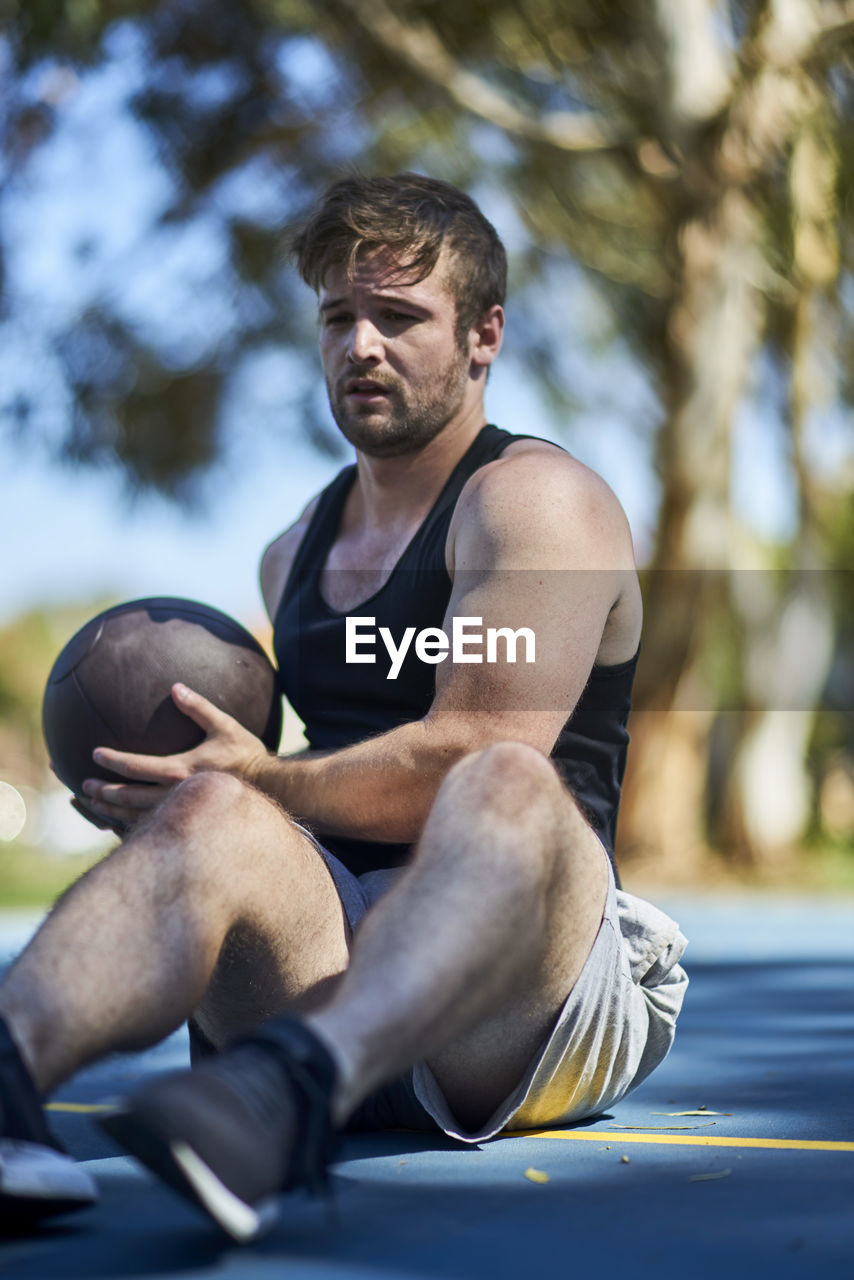 Man playing with ball at park