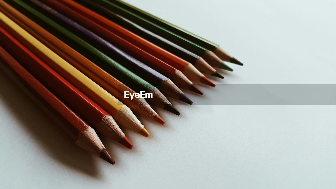 High angle view of colored pencils on desk