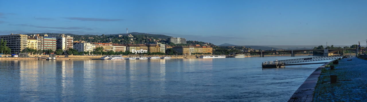 Panoramic view of the danube river and the embankment of buda on a sunny summer morning