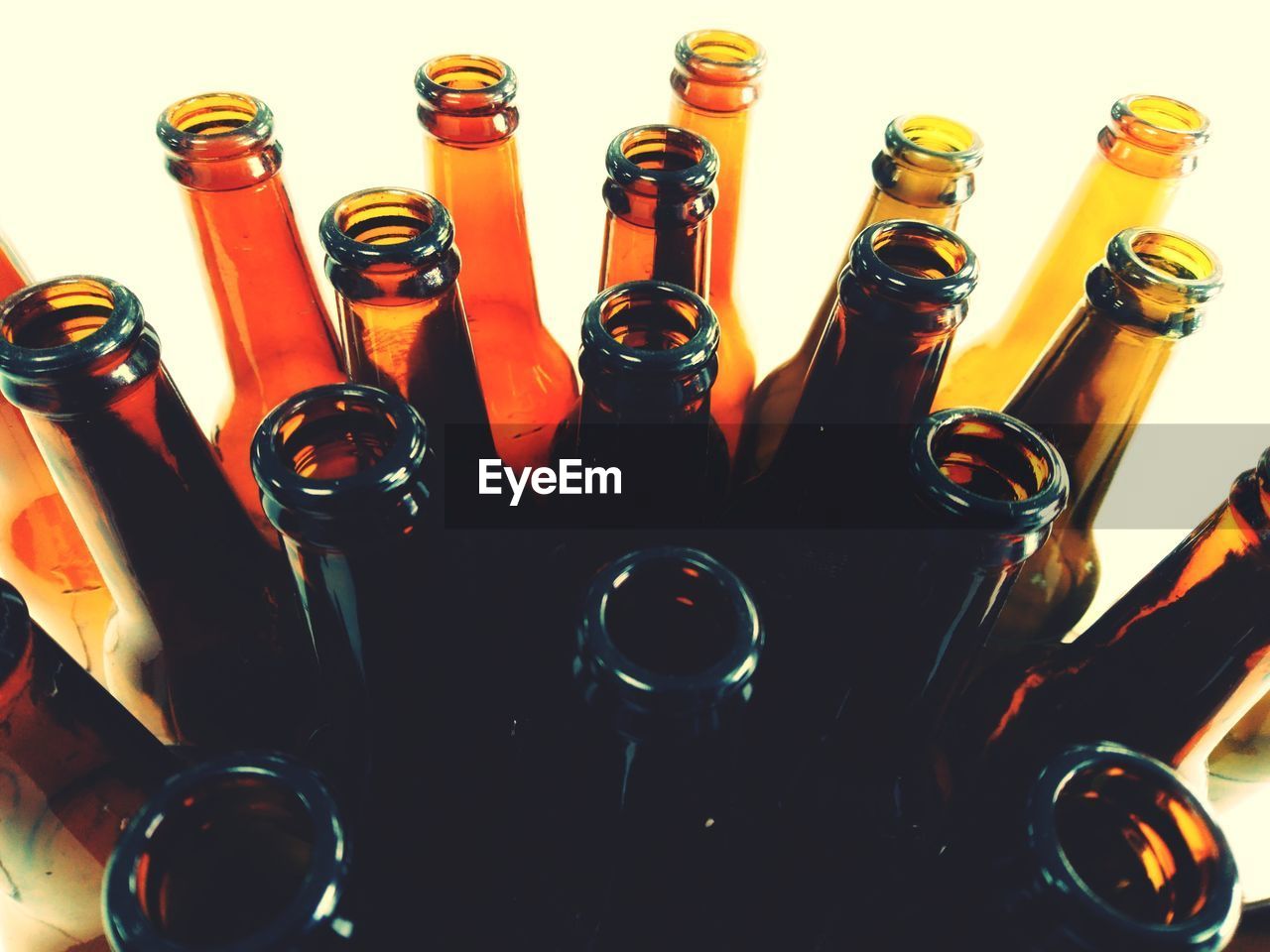 HIGH ANGLE VIEW OF WINE BOTTLES ON GLASS