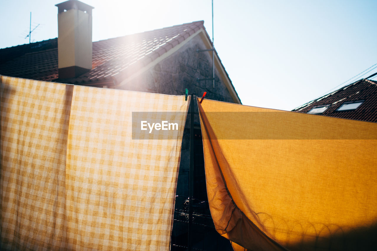 LOW ANGLE VIEW OF BUILT STRUCTURES AGAINST CLEAR SKY