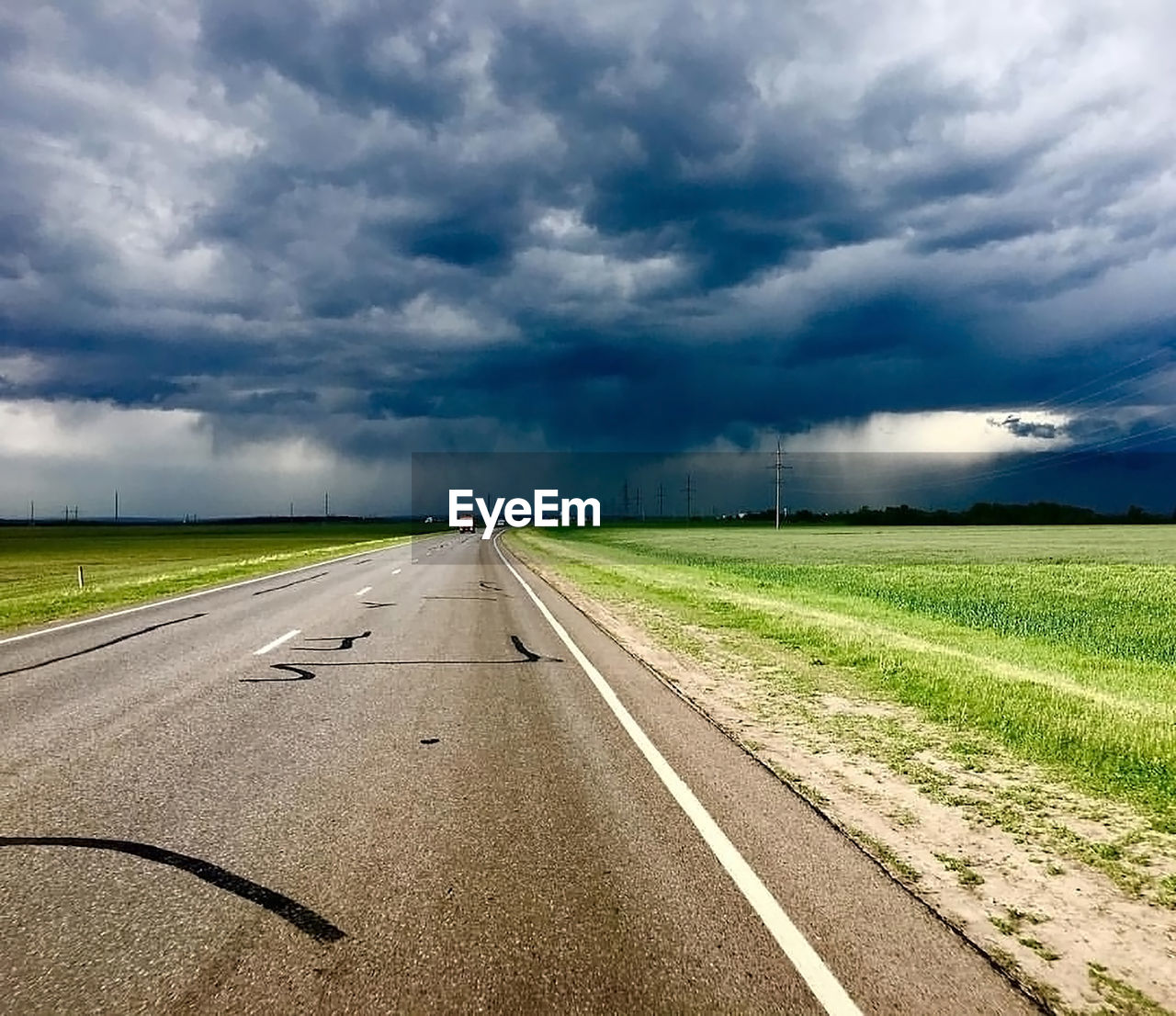 VIEW OF ROAD ALONG LANDSCAPE