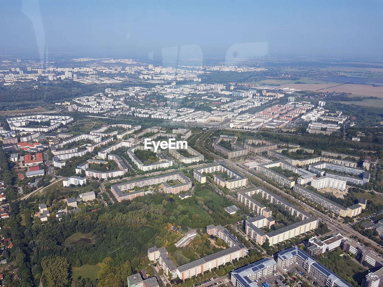 HIGH ANGLE VIEW OF ILLUMINATED BUILDINGS IN CITY