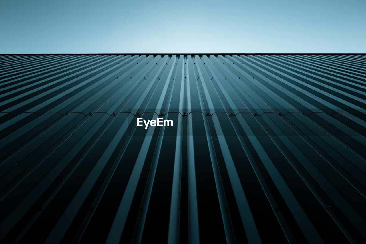 Low angle view of building against blue sky