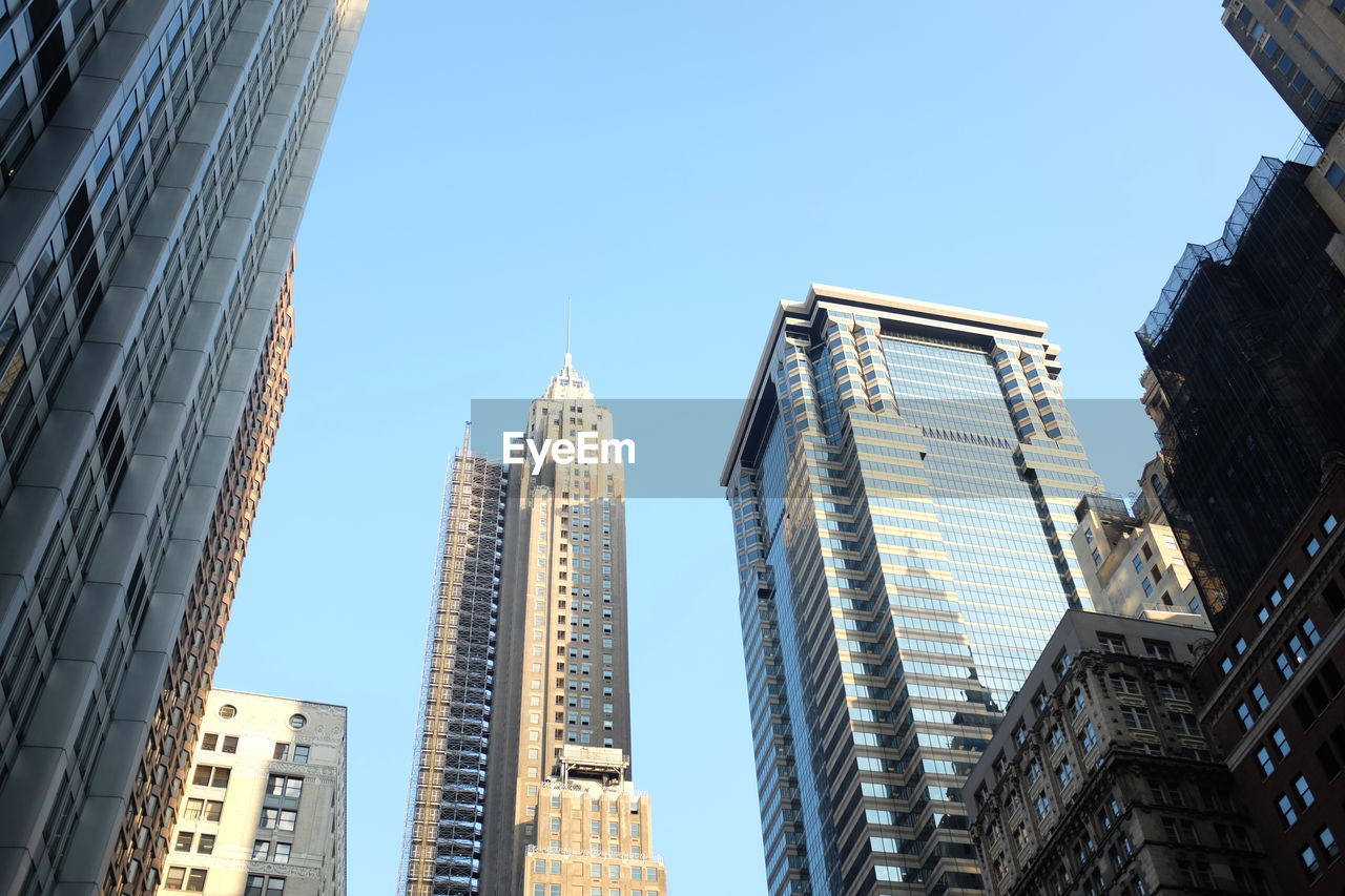 LOW ANGLE VIEW OF SKYSCRAPERS AGAINST SKY