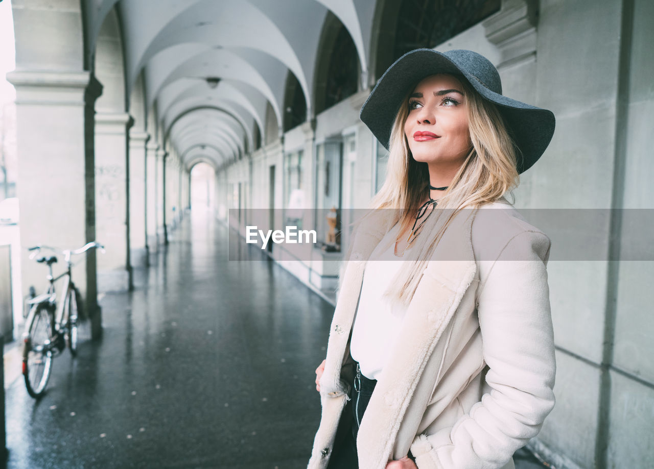 Portrait of woman in arcade