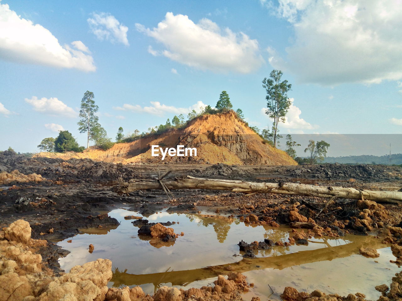 SCENIC VIEW OF ROCK FORMATION AND TREES AGAINST SKY