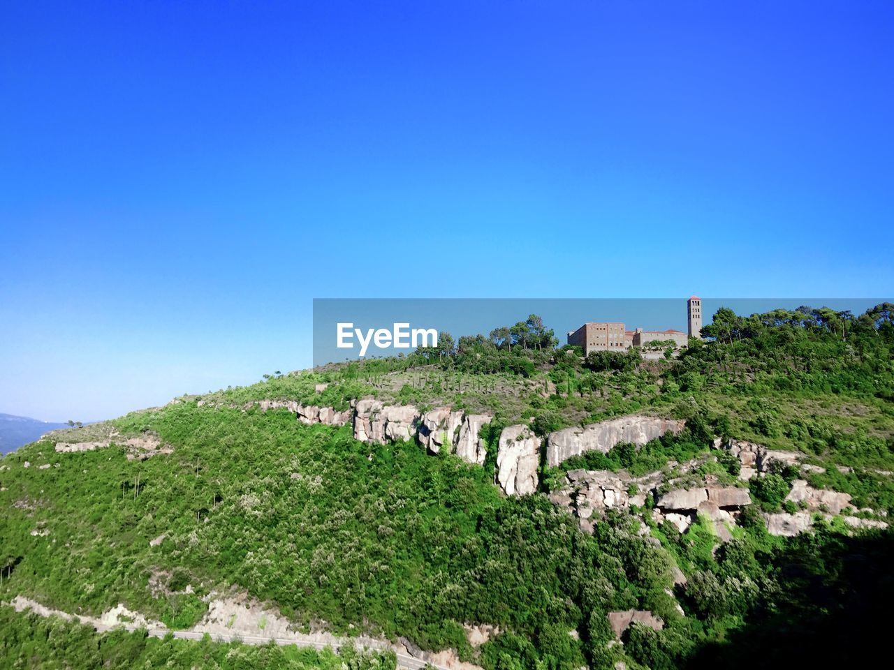 Panoramic shot of historic building against clear blue sky