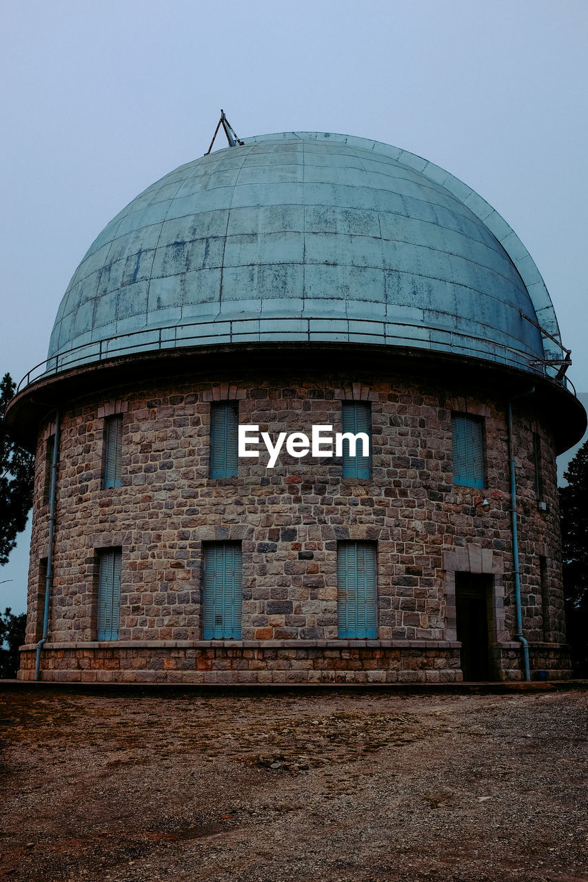 Low angle view of old building against clear sky