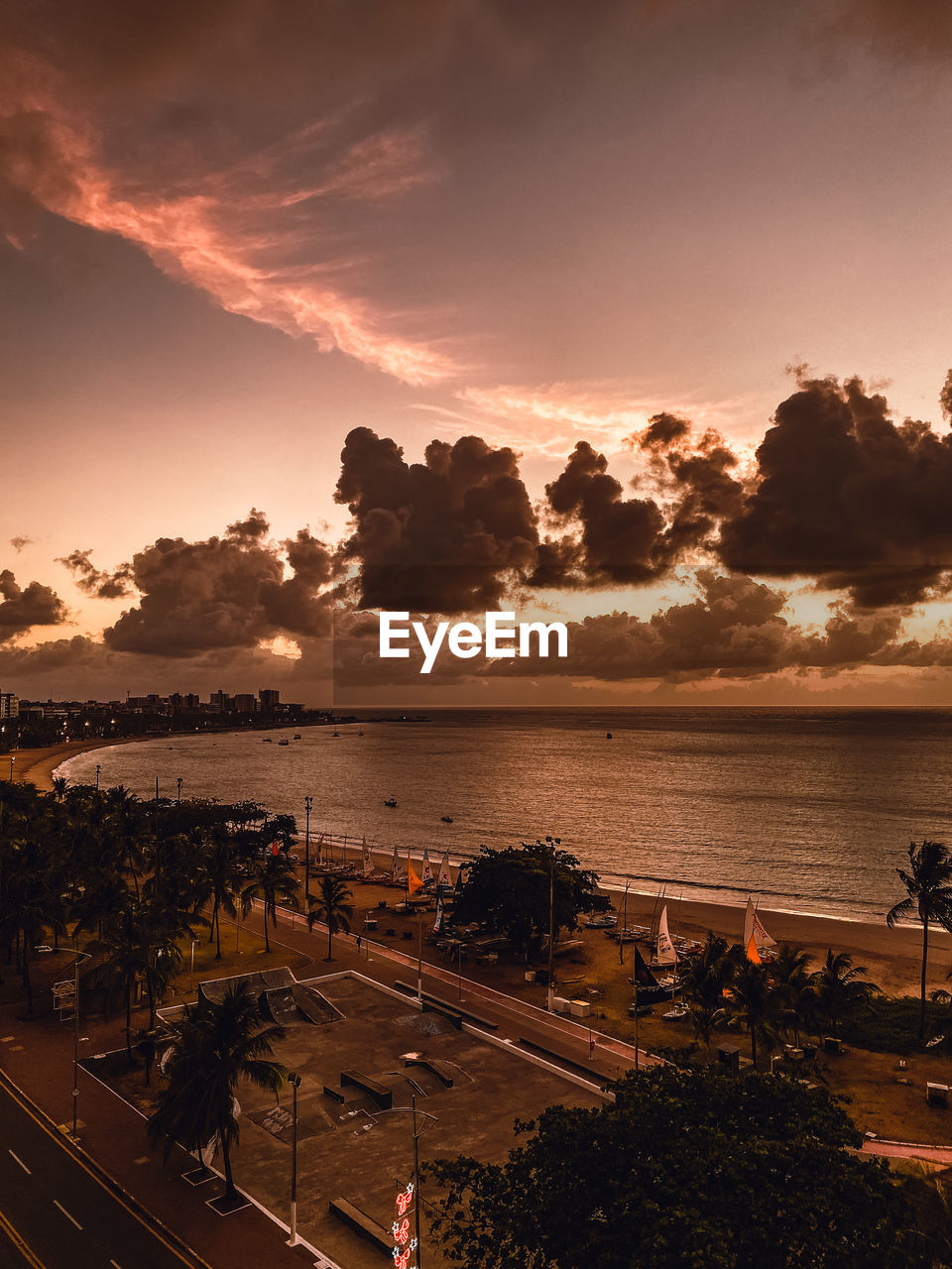 High angle view of sea against sky at sunset