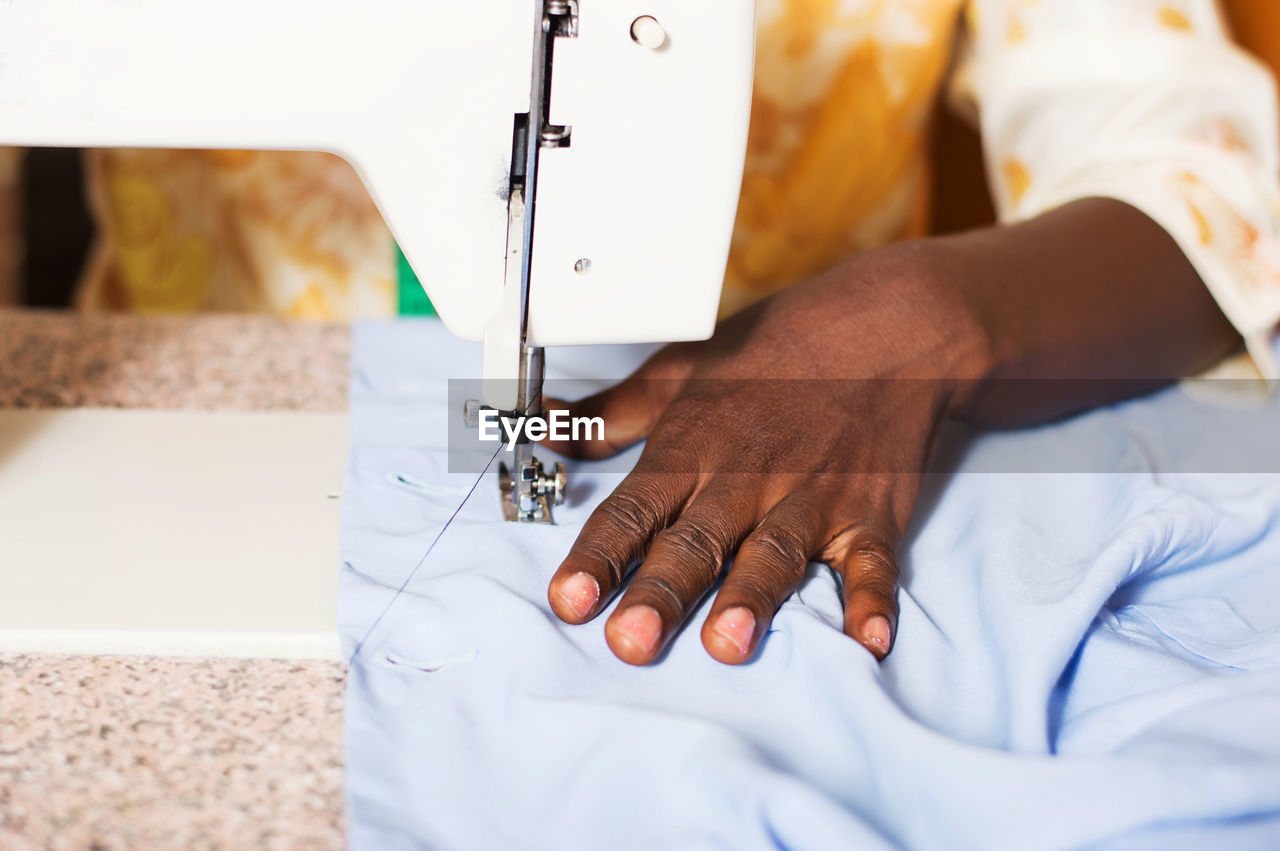 Midsection of man working in workshop