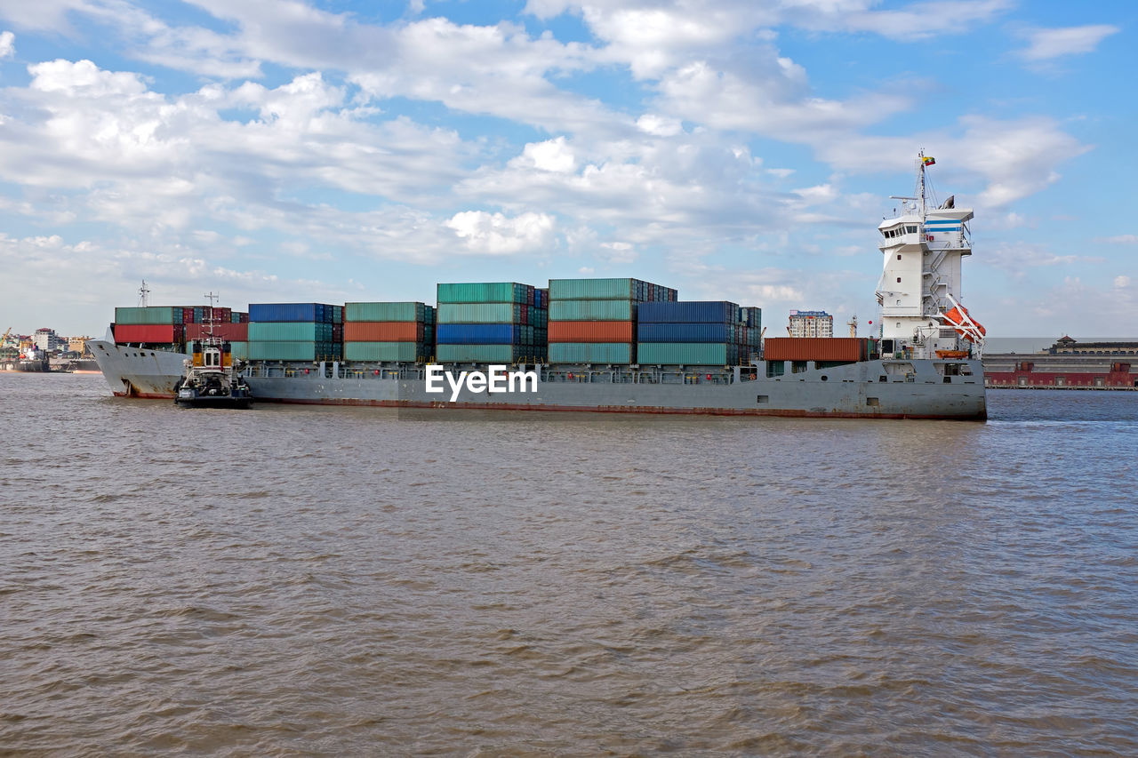 Containership on the yangon river near yangon in myanmar