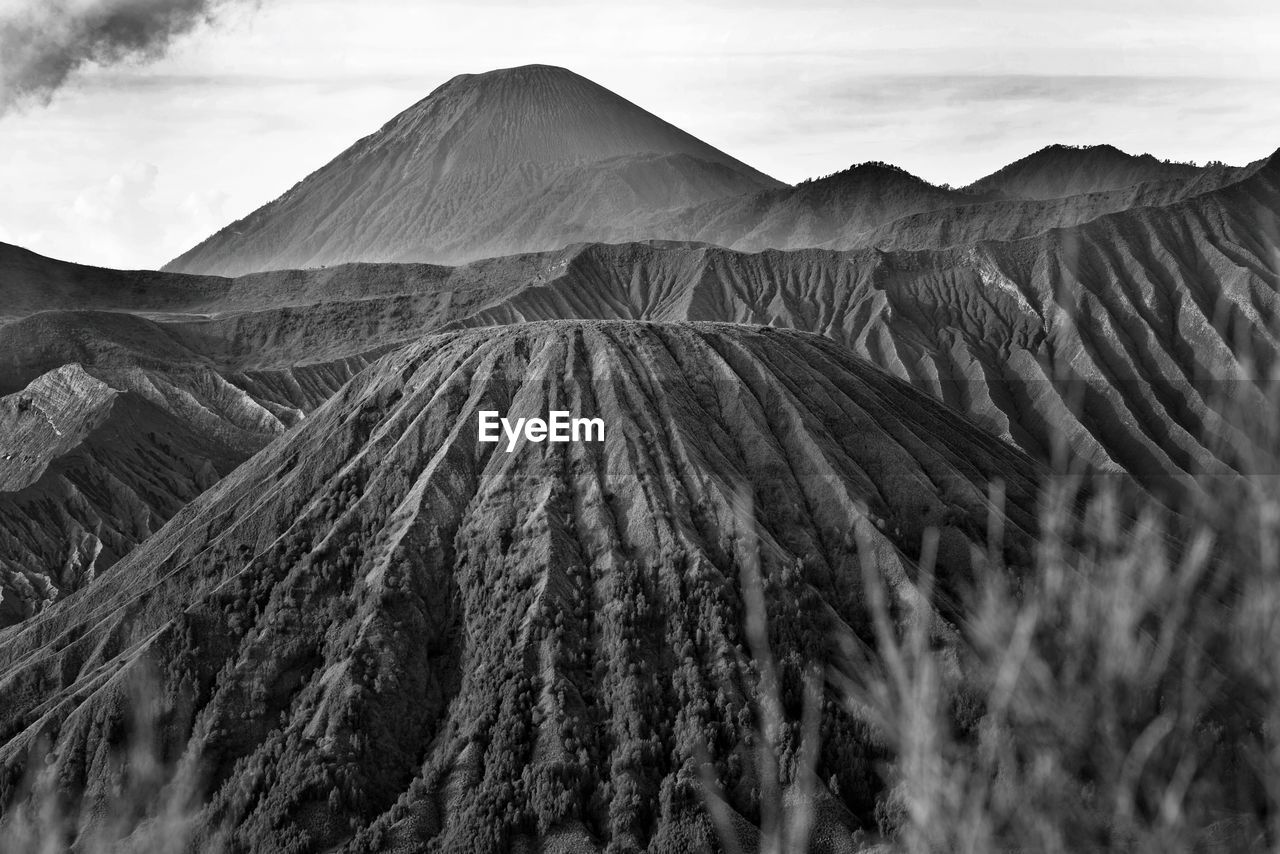 Panoramic view of arid landscape against sky