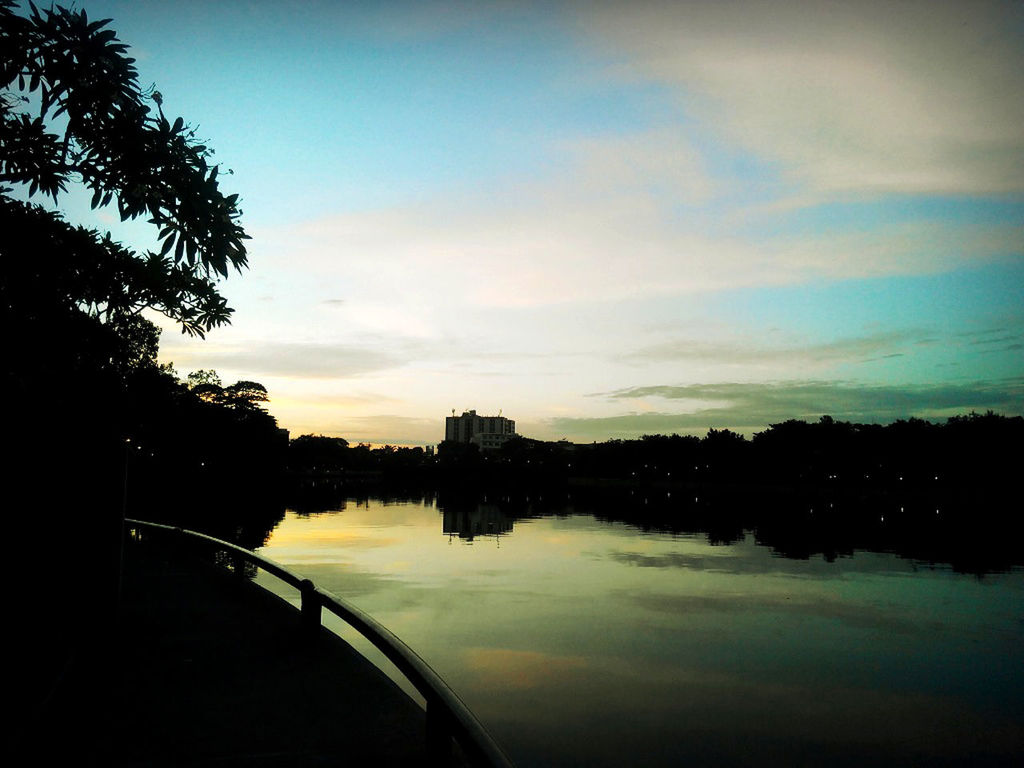 SUNSET OVER CALM LAKE