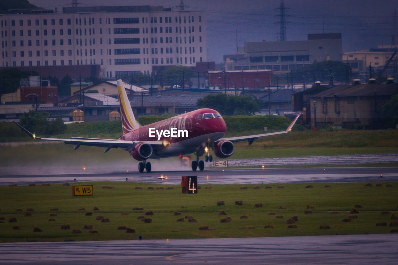 AIRPLANE FLYING IN CITY