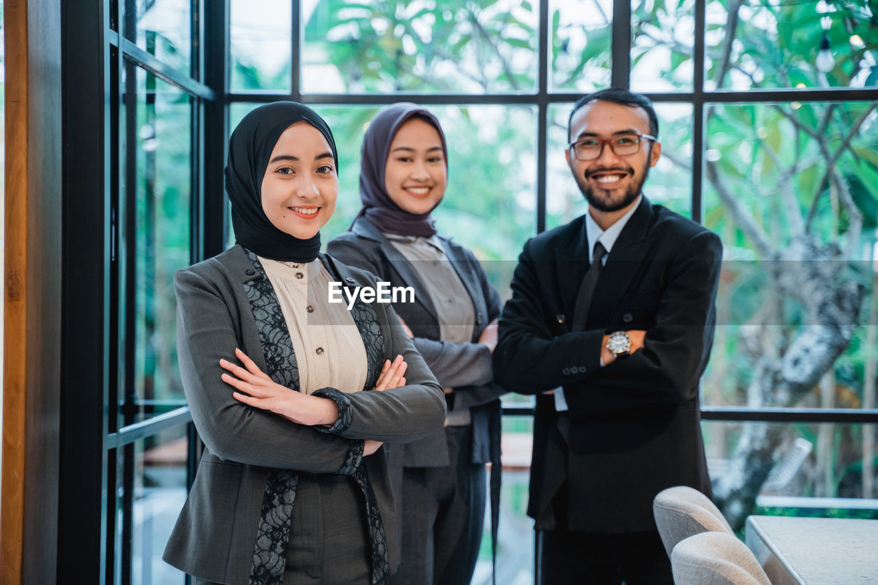 portrait of business colleagues standing in city