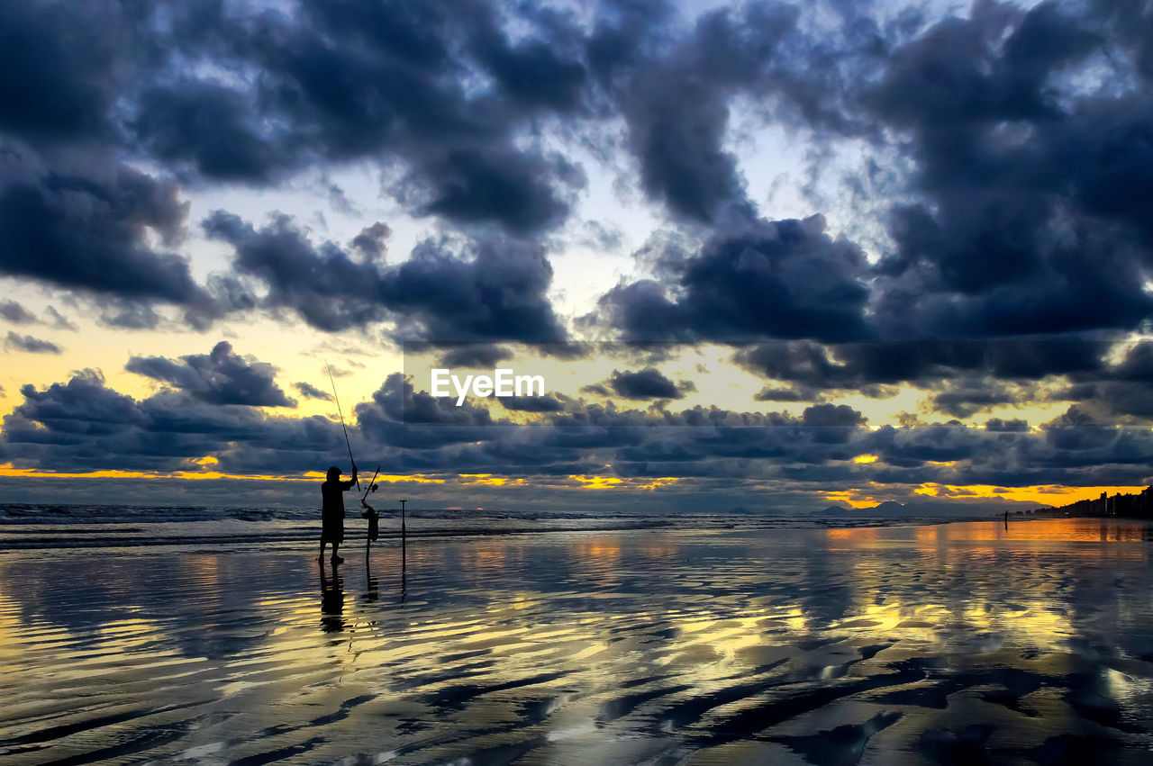 Scenic view of sea against dramatic sky