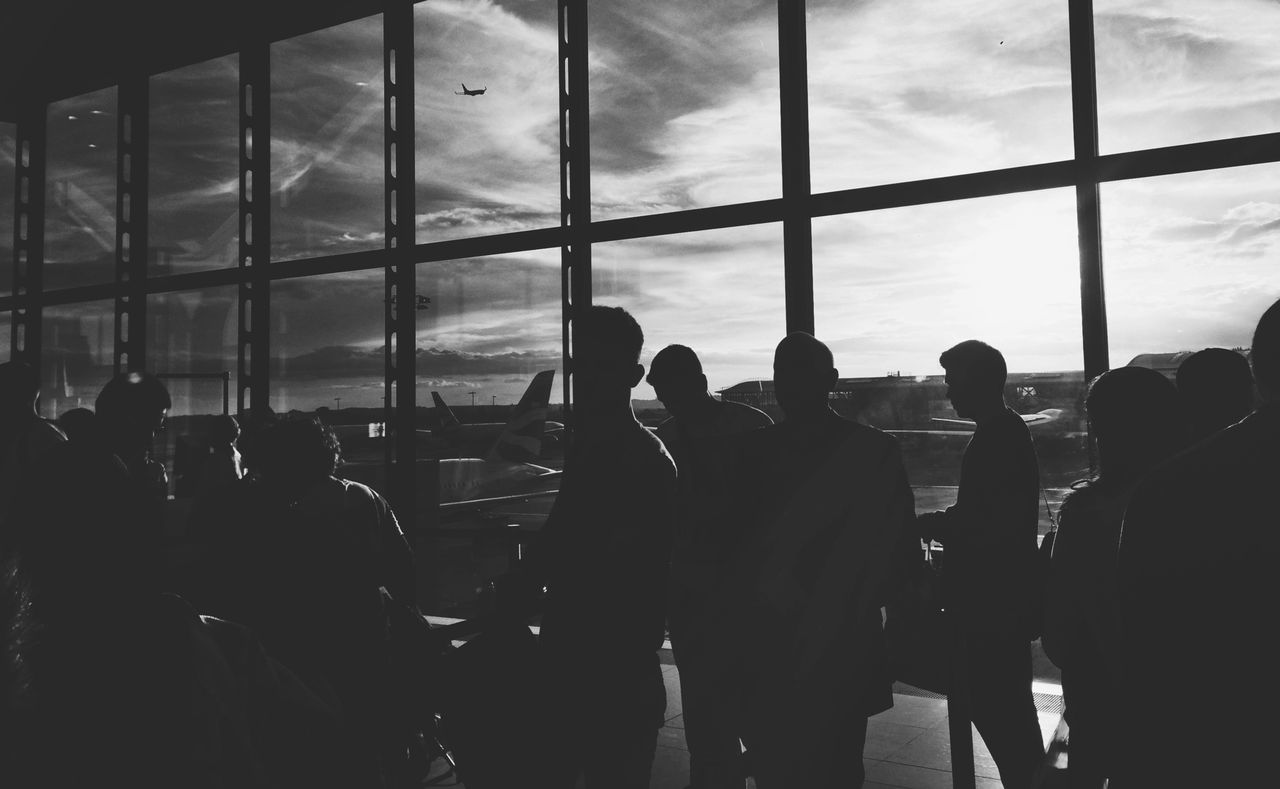 Silhouette people waiting at airport