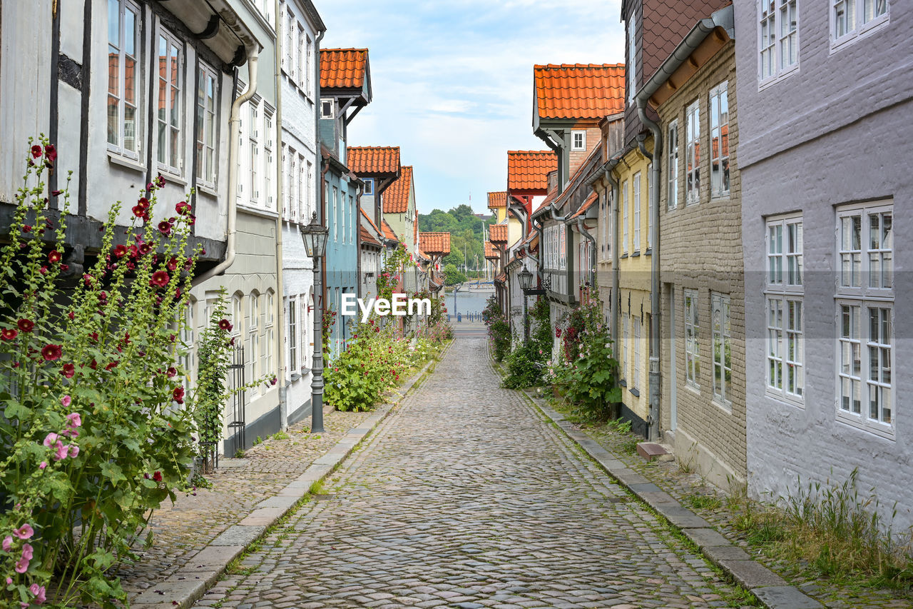 footpath amidst buildings