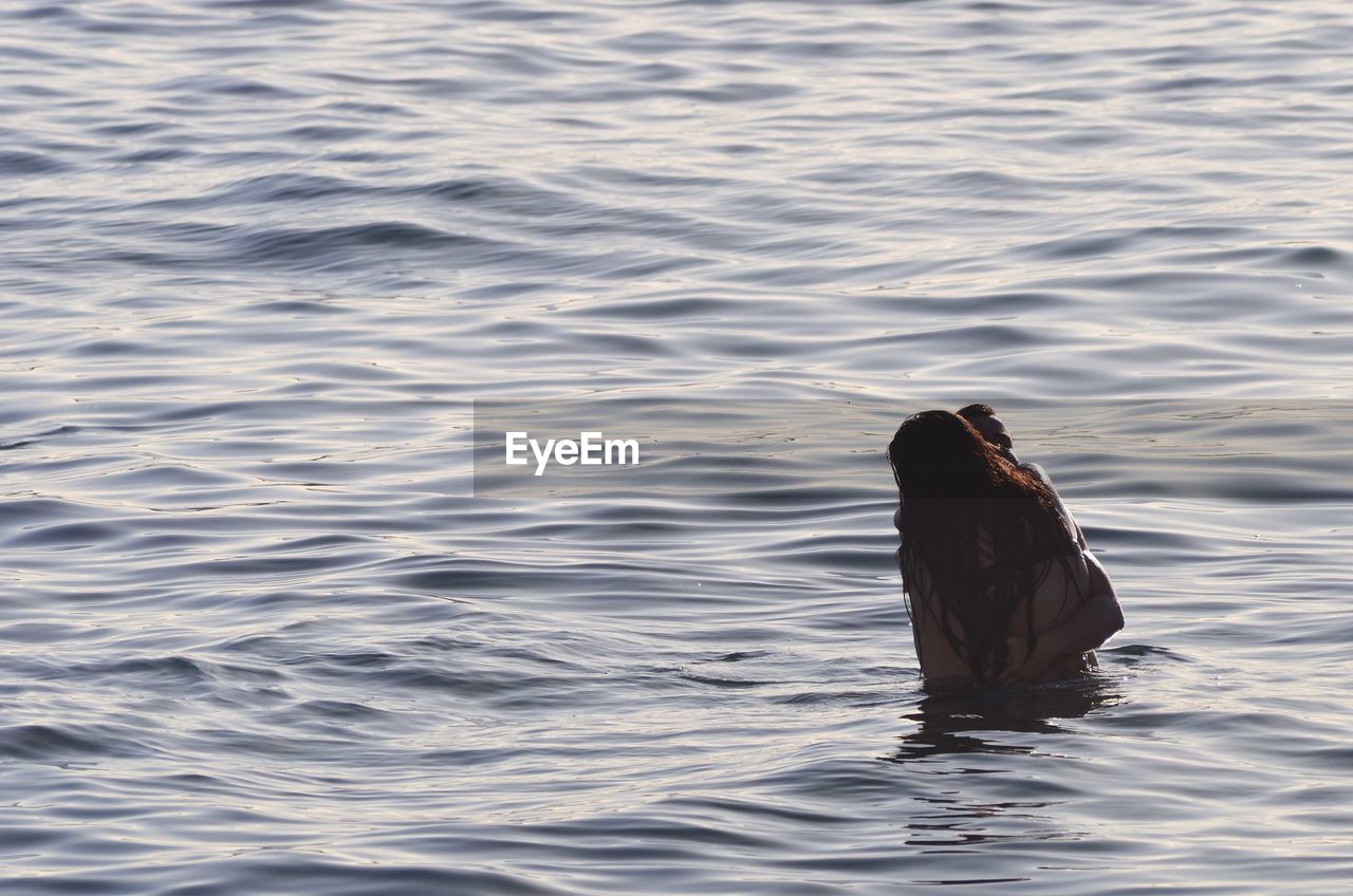 Couple swimming in sea