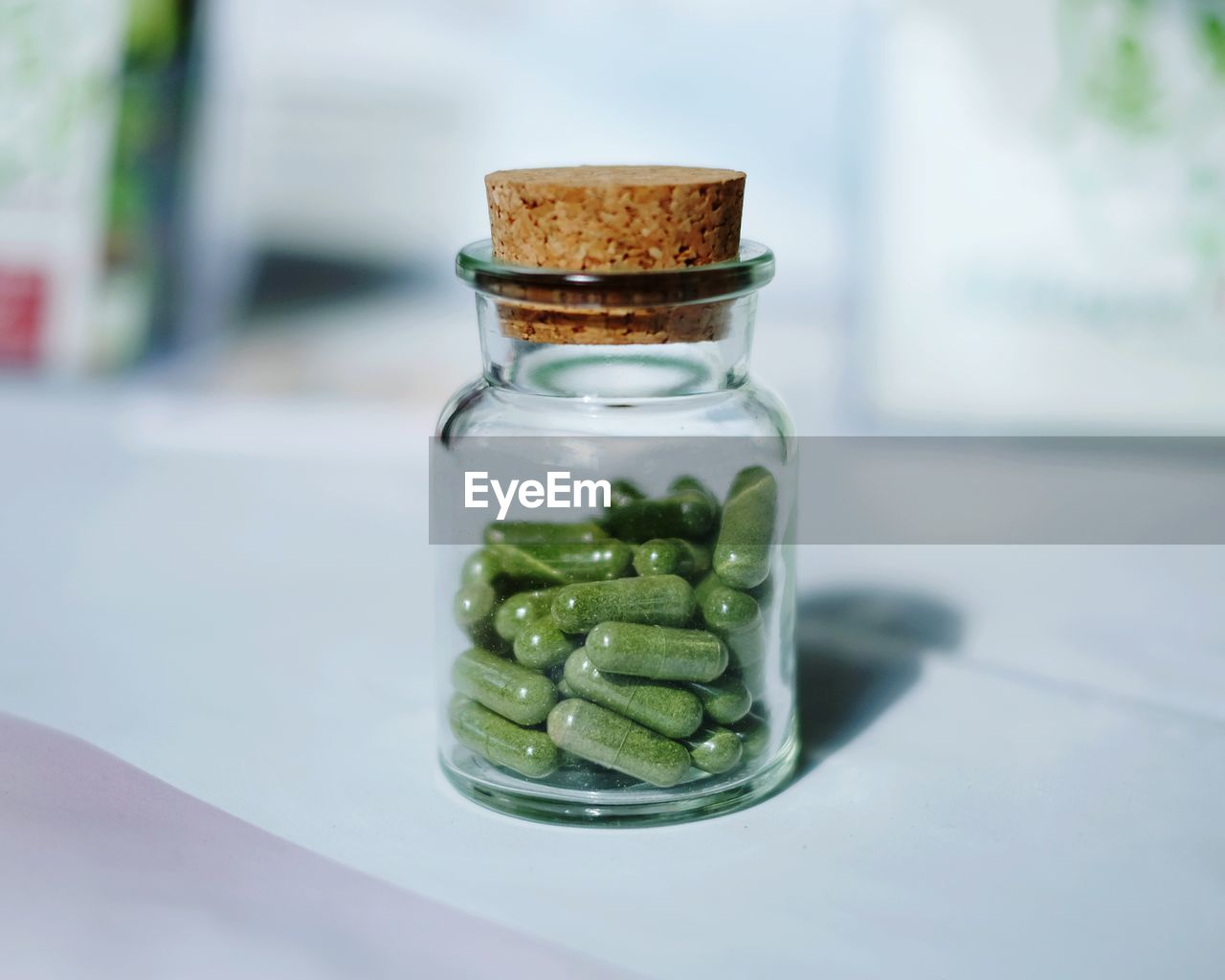Close-up of capsules in glass bottle