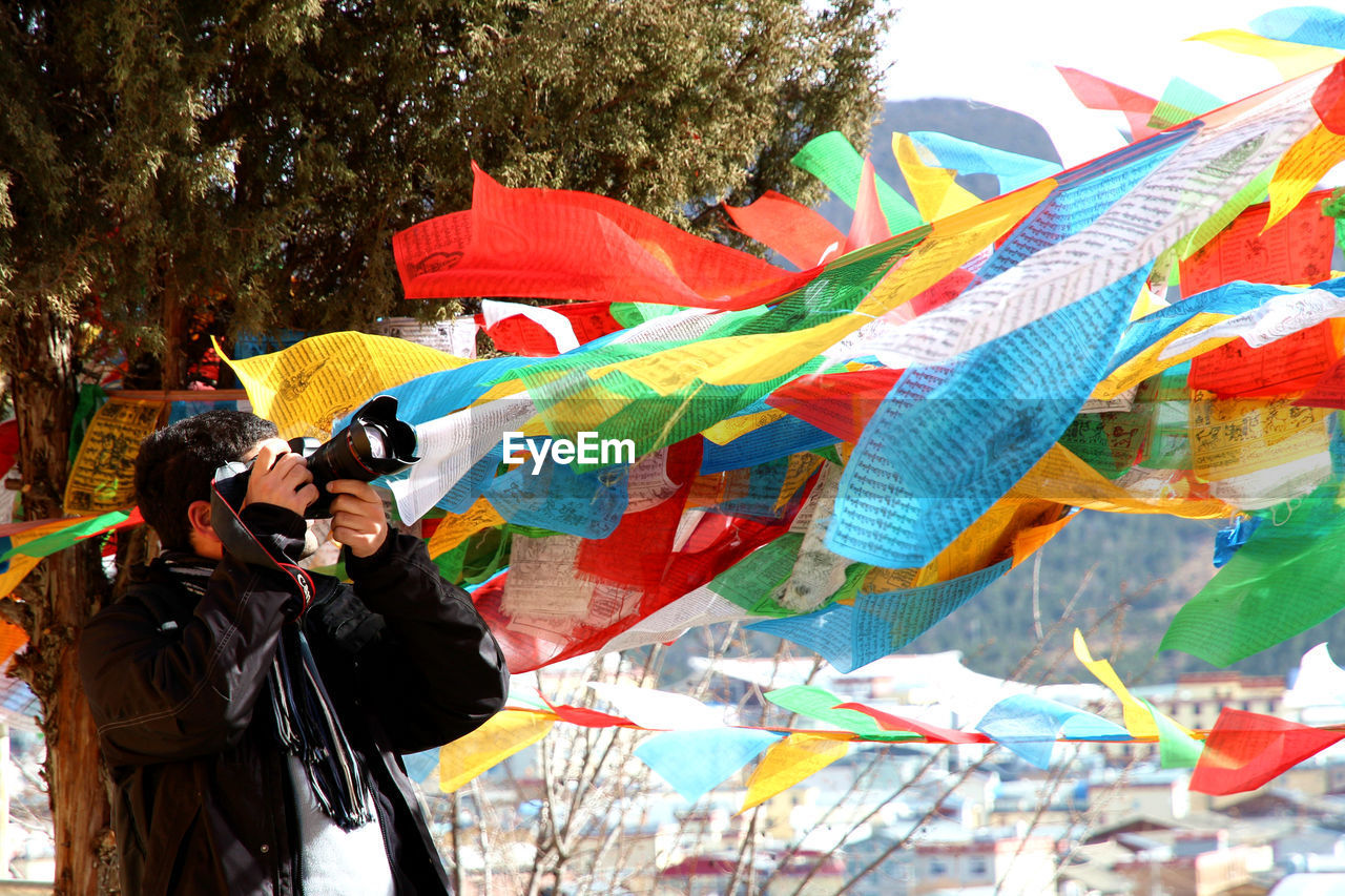 CLOSE-UP OF MULTI COLORED UMBRELLA