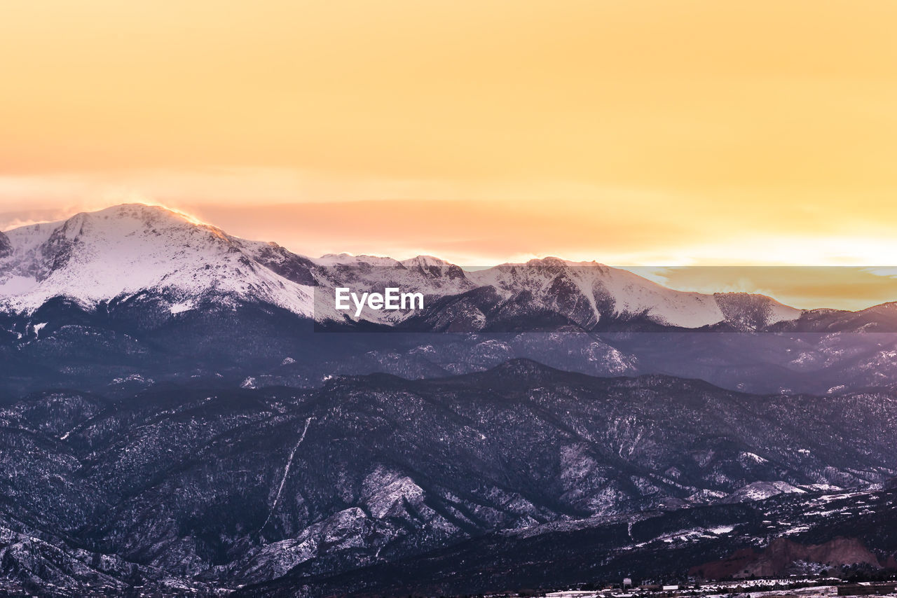 Scenic view of mountains against sky during sunset