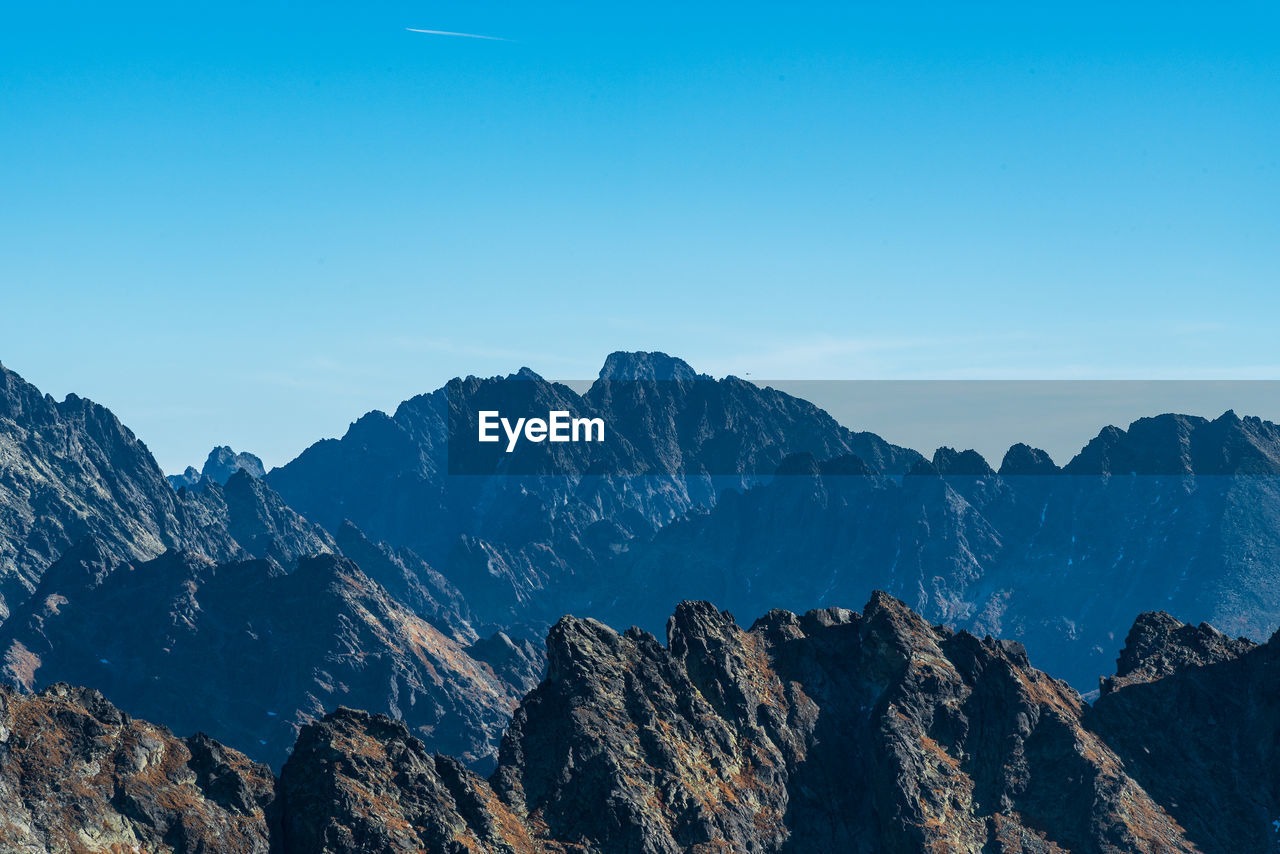 SCENIC VIEW OF MOUNTAINS AGAINST CLEAR BLUE SKY