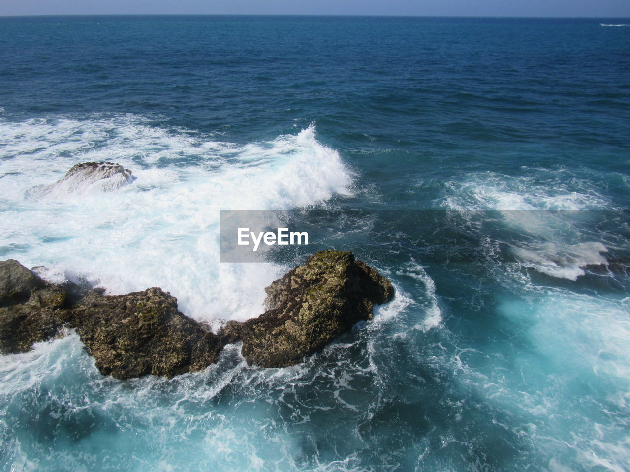 WAVES BREAKING ON ROCKS