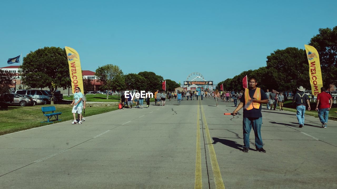 PEOPLE WALKING ON ROAD