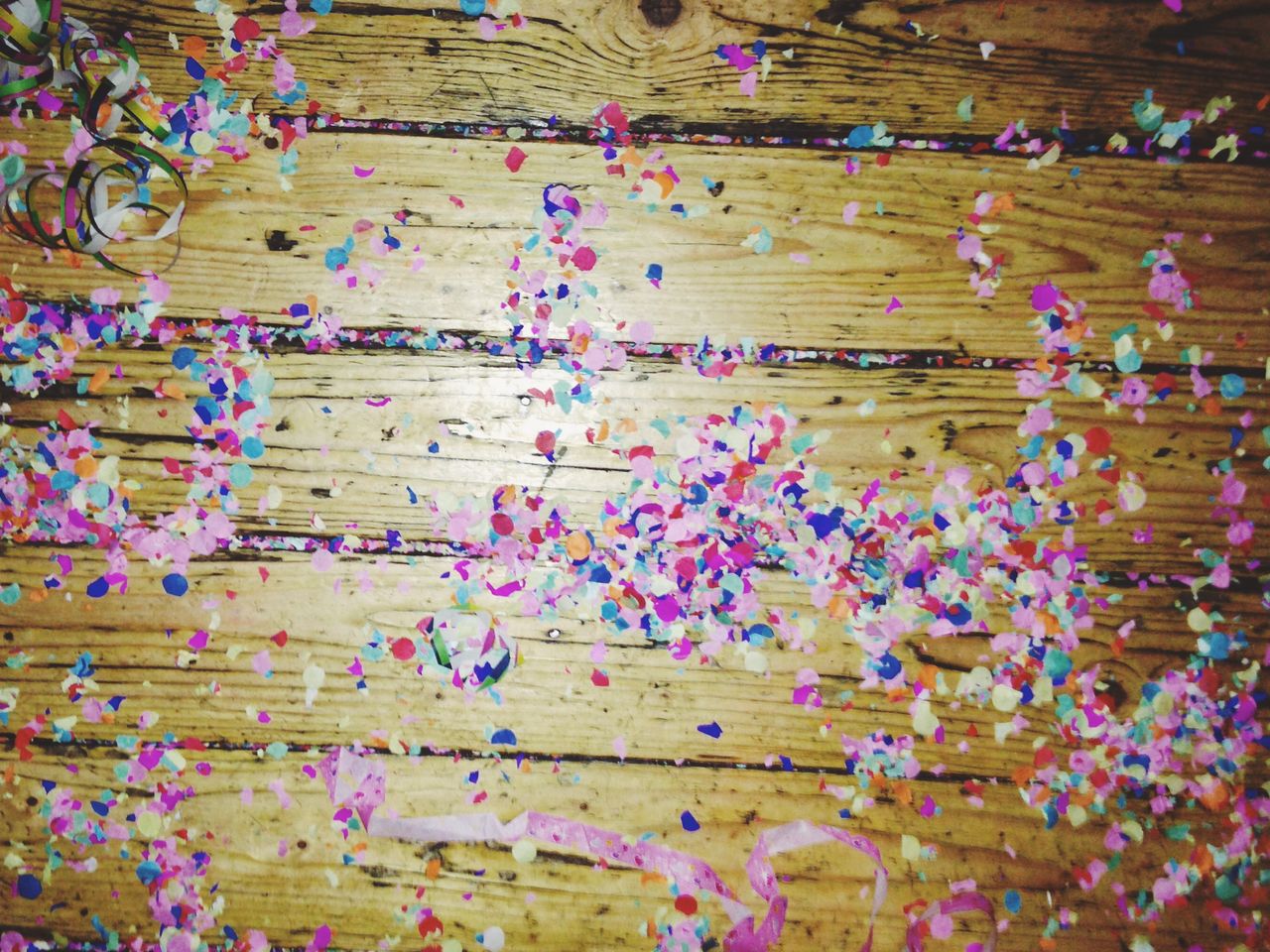 Confetti on wooden floor