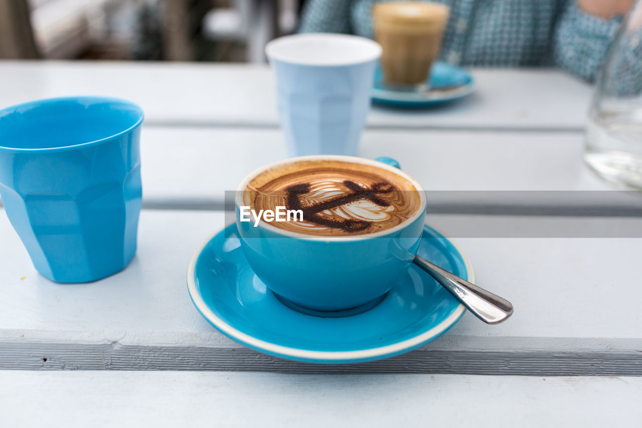 Close-up of coffee cup on table