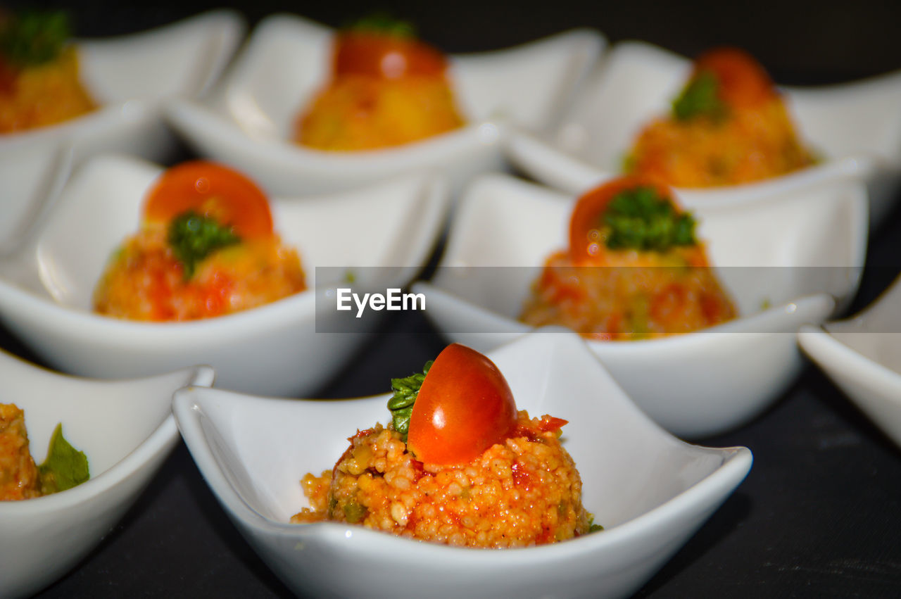 Close-up of couscous salad in plates on table