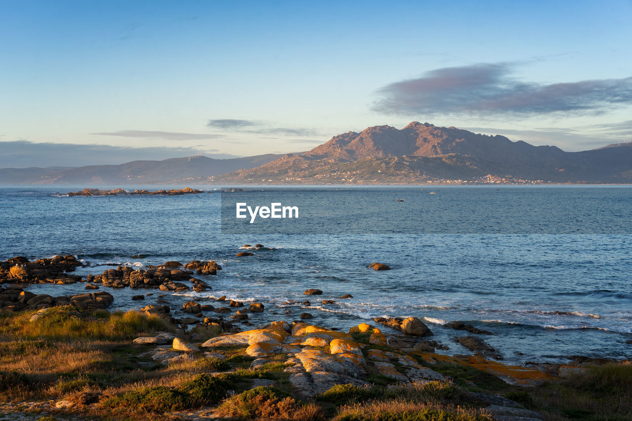 Caldebarcos panorama view of landscape with mountains at sunset with atlantic ocean in galícia