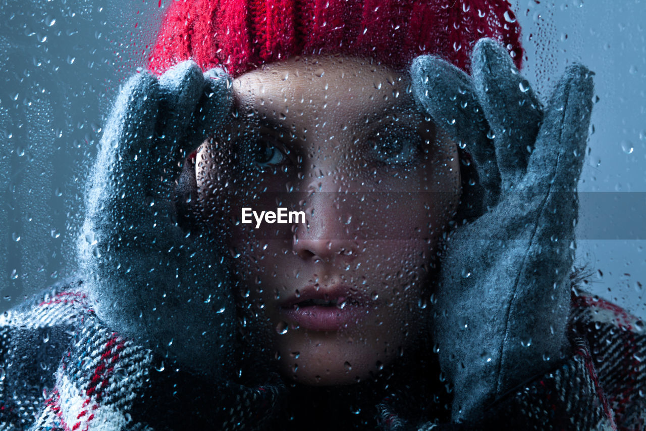 CLOSE-UP PORTRAIT OF WOMAN WITH SNOW DURING RAINY SEASON