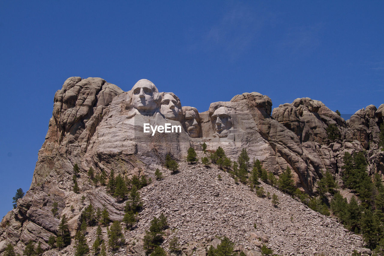 Low angle view of mt rushmore national monument against clear sky