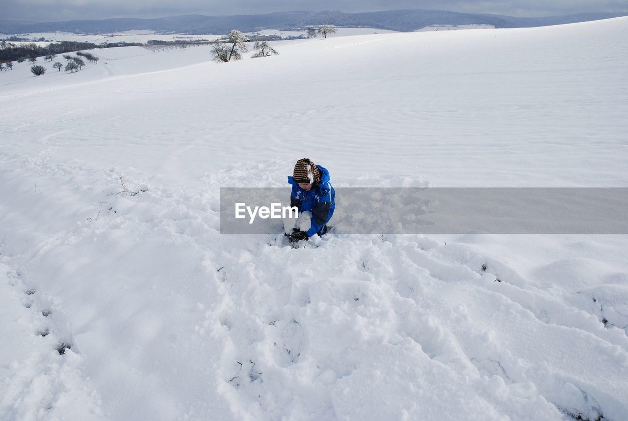 Full length of child on snow on land