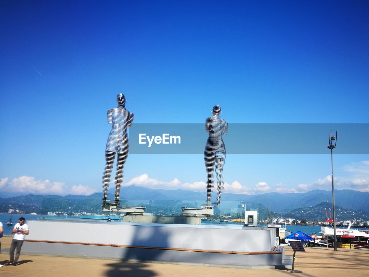 Panoramic view of sea against clear blue sky