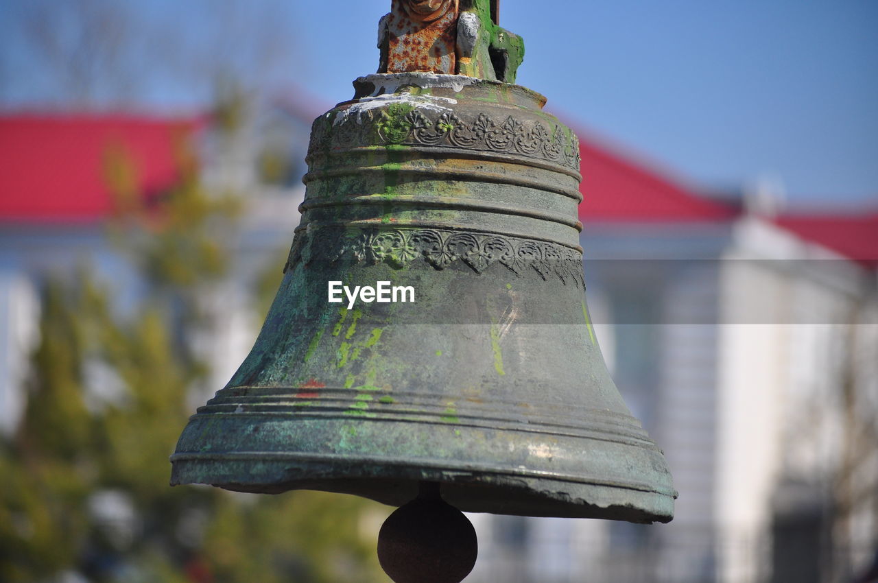 Close-up of old bell tower against sky