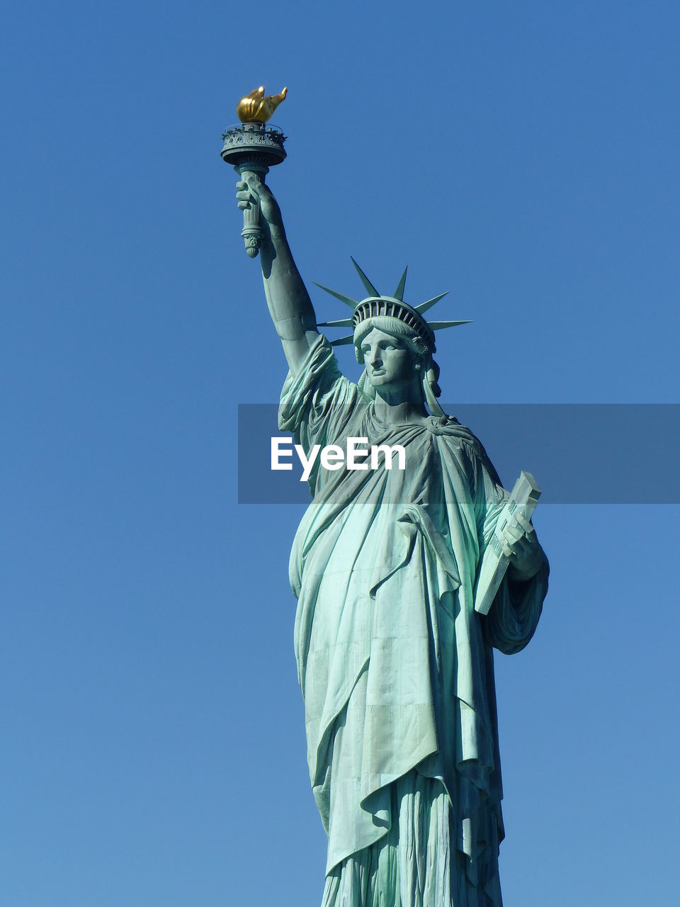 Statue of liberty against blue sky