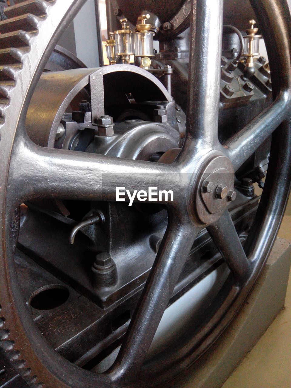 Close-up of metallic wheel at factory