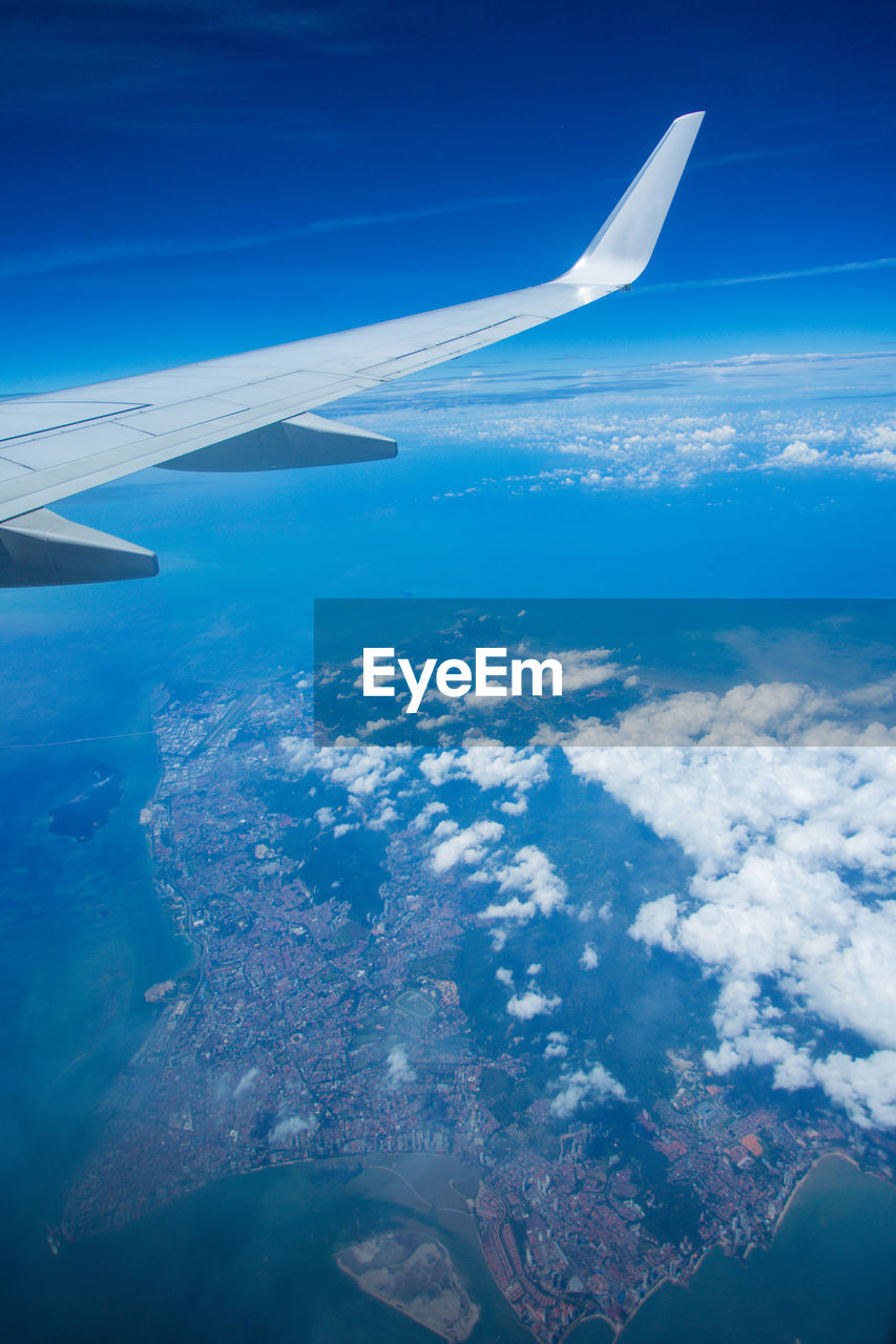 AERIAL VIEW OF CLOUDS OVER SEA AGAINST SKY