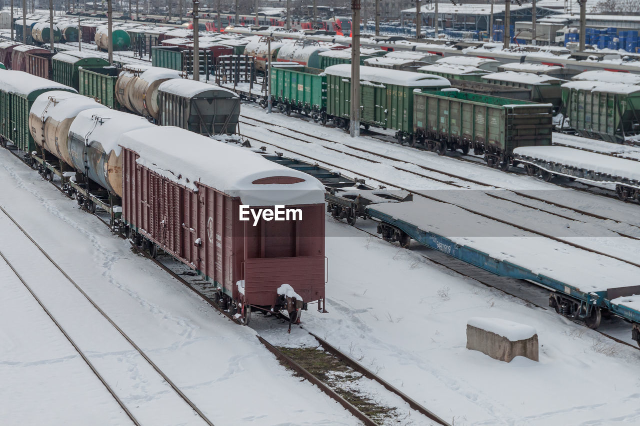 HIGH ANGLE VIEW OF RAILROAD TRACKS DURING WINTER