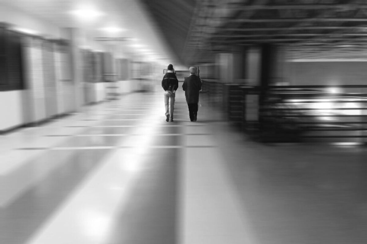 BLURRED MOTION OF WOMAN IN TUNNEL