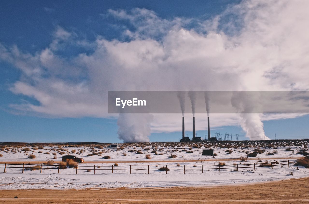 SMOKE EMITTING FROM GEYSER AGAINST SKY