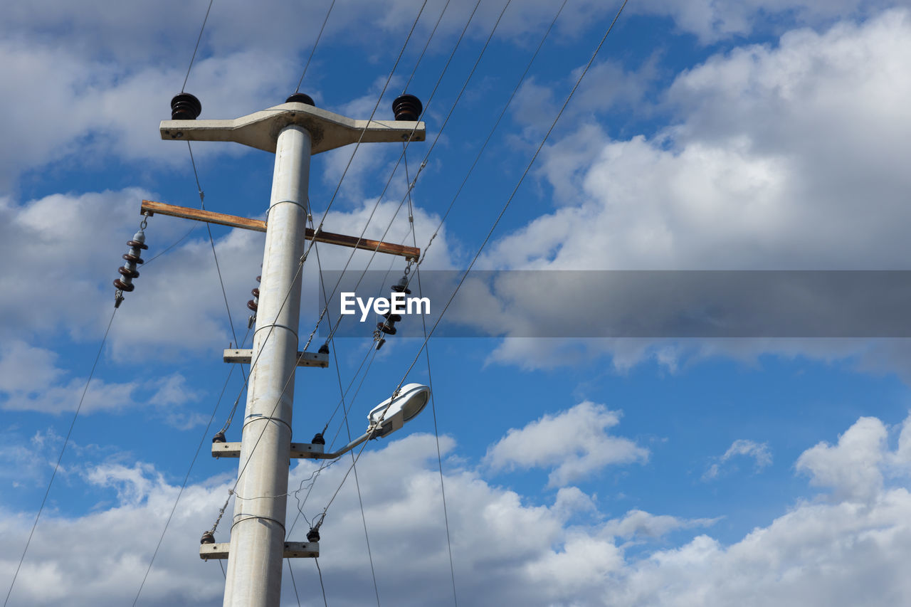 cloud, sky, blue, wind, technology, low angle view, electricity, mast, overhead power line, nature, day, machine, no people, outdoors, tower, communication, street light, pole, wind turbine, power generation, cable