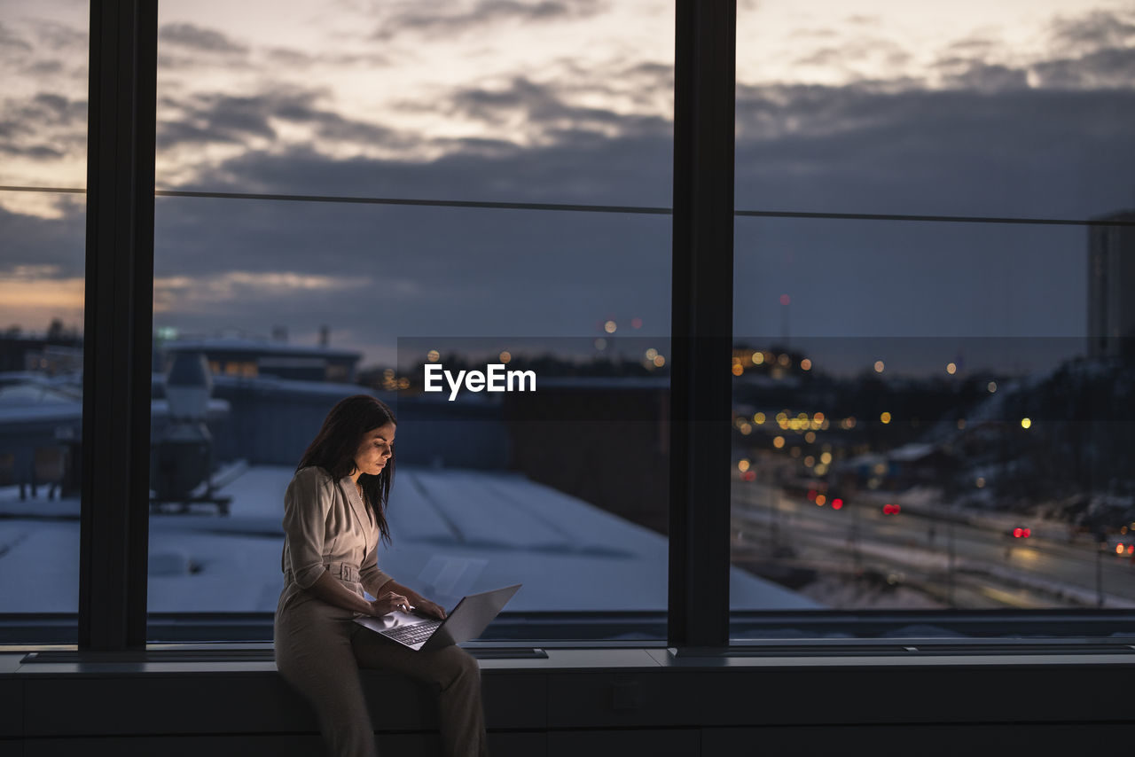 Businesswoman working late in office