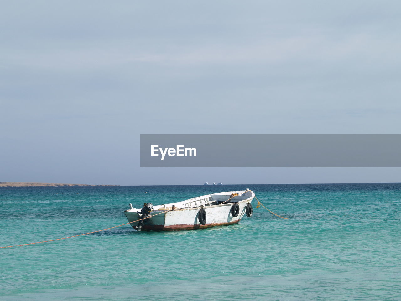 Boat in sea against sky