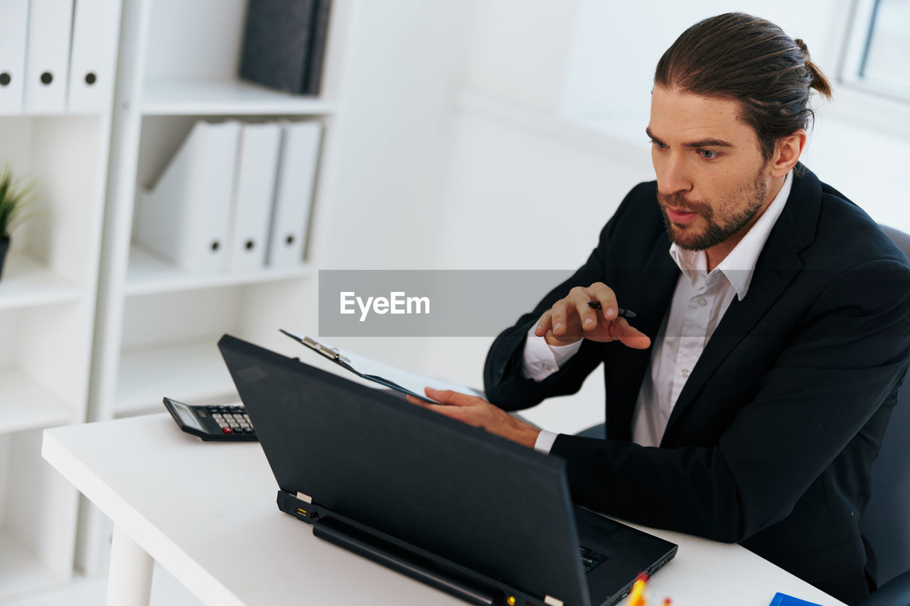 Businessman talking on video conference at office