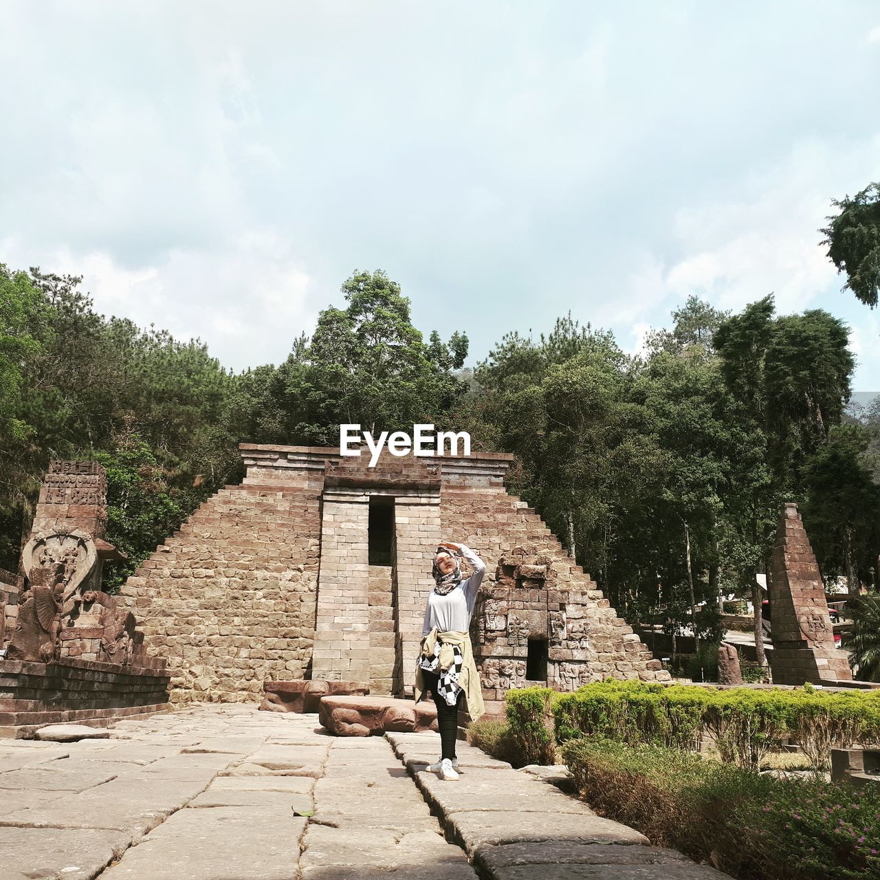 Woman was standing in front of sukuh temple